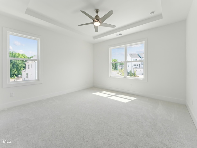 812 Barlow Dr Unit 255, Knightdale, NC 27545 - empty room featuring a raised ceiling, carpet flooring, a ceiling fan, and a smoke detector