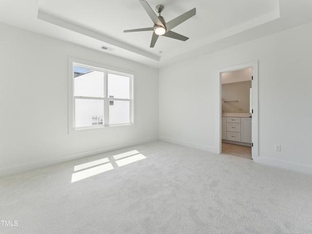 812 Barlow Dr Unit 255, Knightdale, NC 27545 - unfurnished room with a tray ceiling, light colored carpet, and a ceiling fan