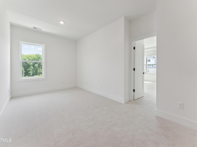 812 Barlow Dr Unit 255, Knightdale, NC 27545 - spare room featuring baseboards and light carpet