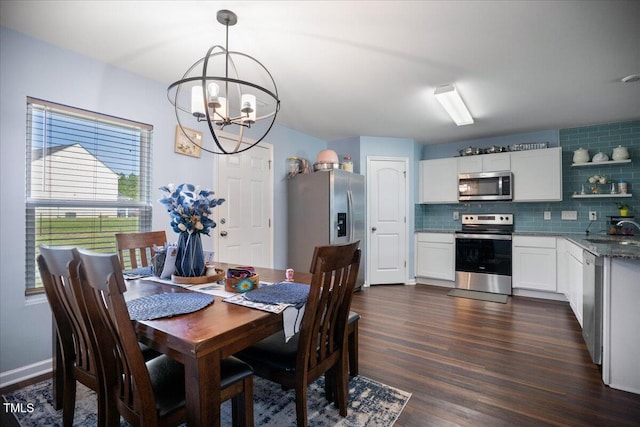 443 Waterfall Rd, Henderson, NC 27537 - dining area featuring a chandelier and dark wood-style flooring