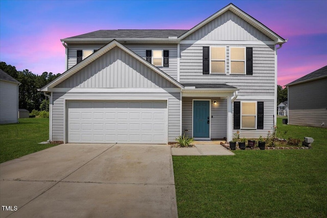 443 Waterfall Rd, Henderson, NC 27537 - view of front facade with driveway, a yard, a garage, and board and batten siding