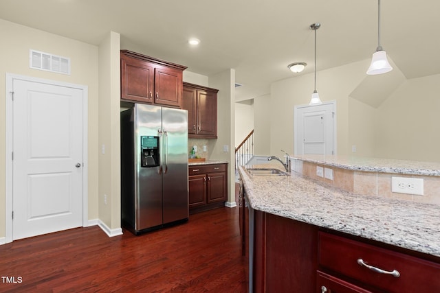 508 Durants Neck Ln, Morrisville, NC 27560 - kitchen with stainless steel refrigerator with ice dispenser, dark wood finished floors, decorative light fixtures, and light stone counters