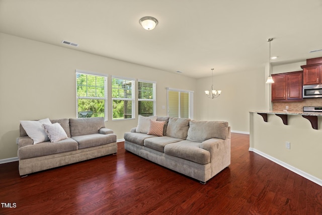 508 Durants Neck Ln, Morrisville, NC 27560 - living room featuring a chandelier and dark wood-style flooring