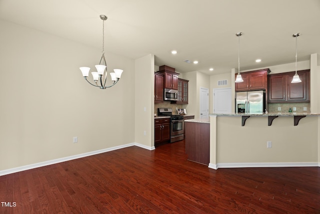 508 Durants Neck Ln, Morrisville, NC 27560 - kitchen with stainless steel appliances, a breakfast bar area, backsplash, dark wood-style floors, and recessed lighting