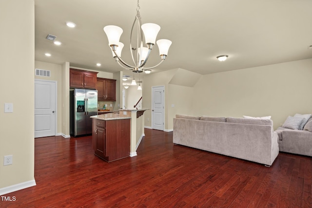 508 Durants Neck Ln, Morrisville, NC 27560 - kitchen with stainless steel fridge with ice dispenser, open floor plan, a chandelier, dark wood finished floors, and recessed lighting