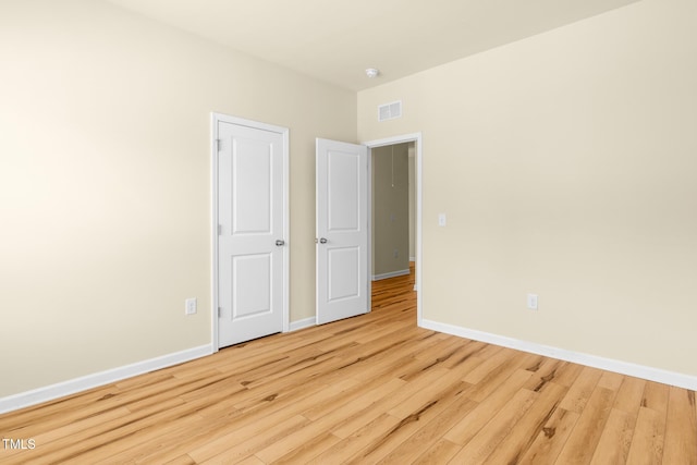 508 Durants Neck Ln, Morrisville, NC 27560 - unfurnished bedroom with wood finished floors and baseboards