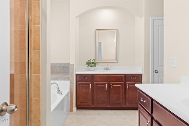 508 Durants Neck Ln, Morrisville, NC 27560 - bathroom with two vanities, a bath, a tile shower, and tile patterned floors
