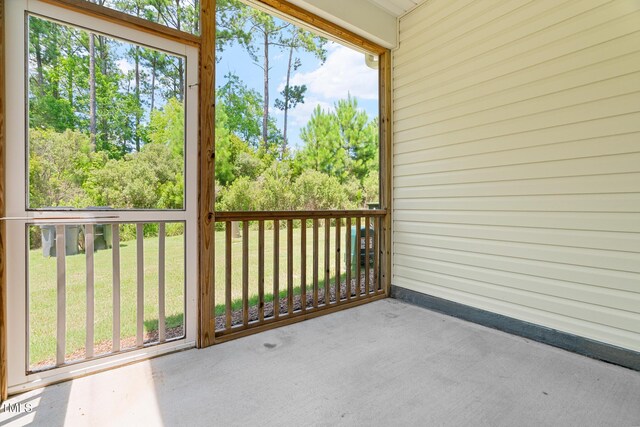 508 Durants Neck Ln, Morrisville, NC 27560 - unfurnished sunroom featuring view of wooded area