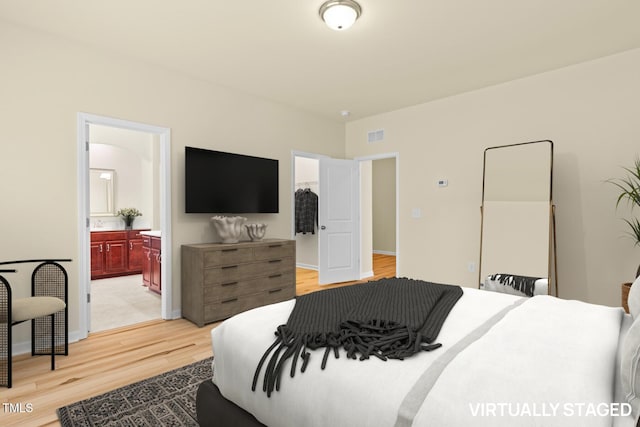 508 Durants Neck Ln, Morrisville, NC 27560 - bedroom with light wood-type flooring and connected bathroom