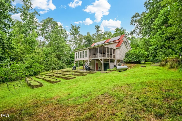 9903 Oak Hollow Rd, Chapel Hill, NC 27516 - rear view of house featuring a sunroom, a garden, and a yard