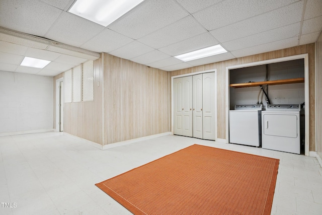 9903 Oak Hollow Rd, Chapel Hill, NC 27516 - finished basement with light flooring, a paneled ceiling, washer and clothes dryer, and wood walls