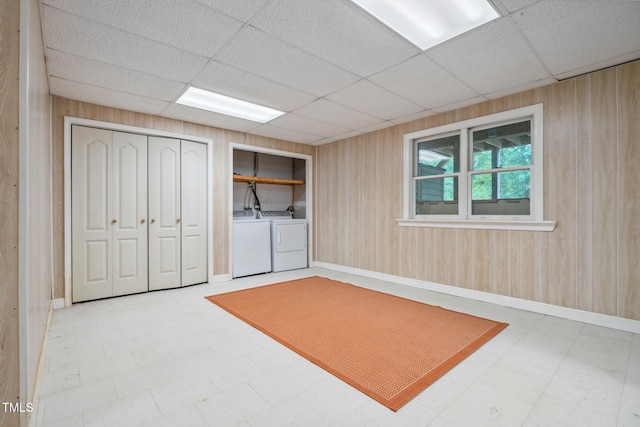 9903 Oak Hollow Rd, Chapel Hill, NC 27516 - below grade area with tile patterned floors, a drop ceiling, washing machine and dryer, and wooden walls