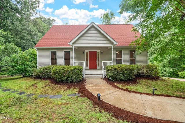 9903 Oak Hollow Rd, Chapel Hill, NC 27516 - view of front of house with a porch and roof with shingles