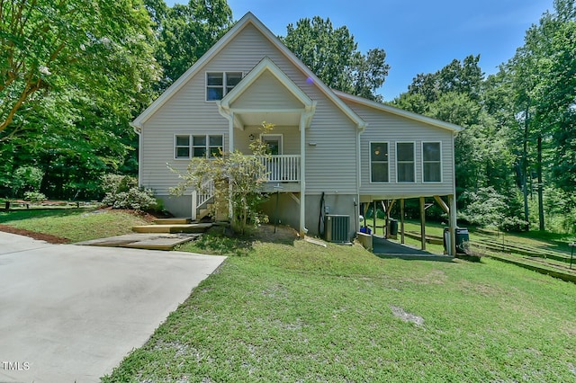 9903 Oak Hollow Rd, Chapel Hill, NC 27516 - view of front facade featuring a front yard, driveway, and a carport
