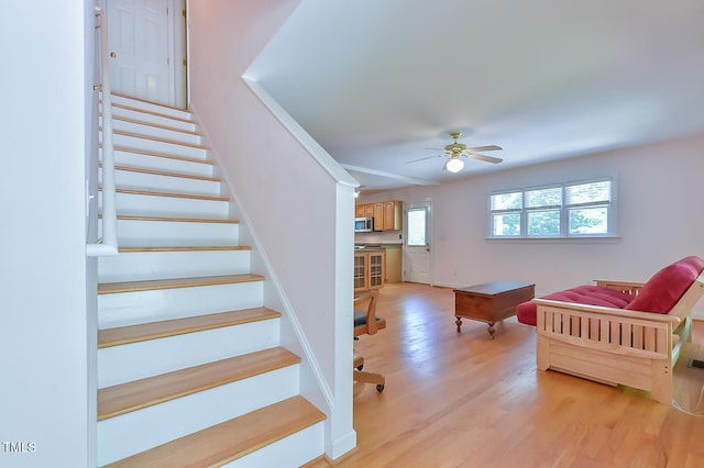 9903 Oak Hollow Rd, Chapel Hill, NC 27516 - stairway with a ceiling fan and wood finished floors