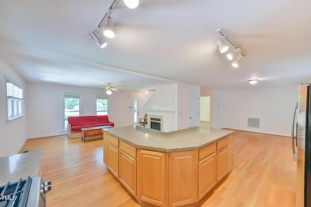 9903 Oak Hollow Rd, Chapel Hill, NC 27516 - kitchen featuring rail lighting, freestanding refrigerator, open floor plan, and light wood finished floors
