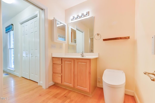 9903 Oak Hollow Rd, Chapel Hill, NC 27516 - bathroom with wood finished floors and vanity