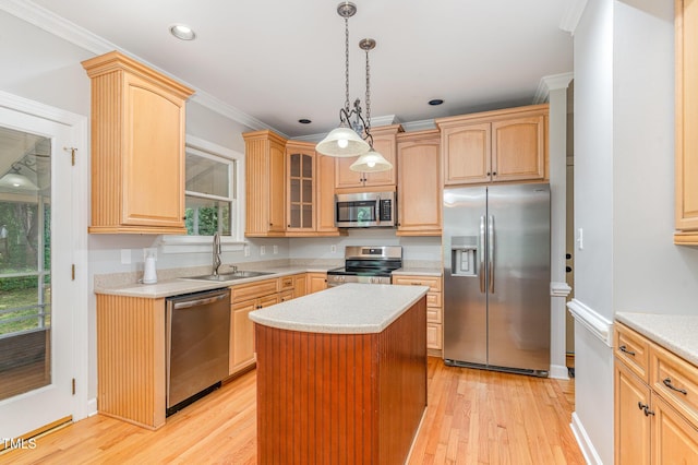 106 Windstream Way, Cary, NC 27518 - kitchen with stainless steel appliances, light countertops, glass insert cabinets, a kitchen island, and light wood-style flooring