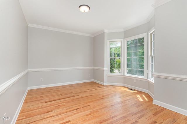 106 Windstream Way, Cary, NC 27518 - empty room featuring light wood finished floors and crown molding