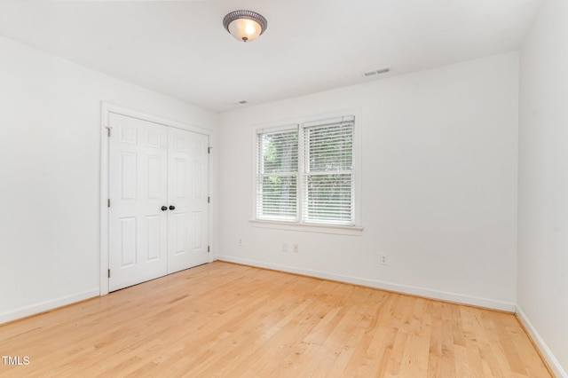 106 Windstream Way, Cary, NC 27518 - unfurnished bedroom featuring wood finished floors and a closet