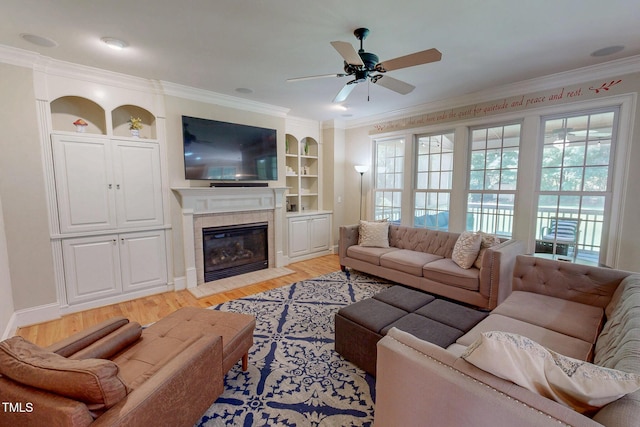 4 Springtree Cir, Durham, NC 27712 - living area featuring a tile fireplace, a ceiling fan, light wood-style floors, and ornamental molding