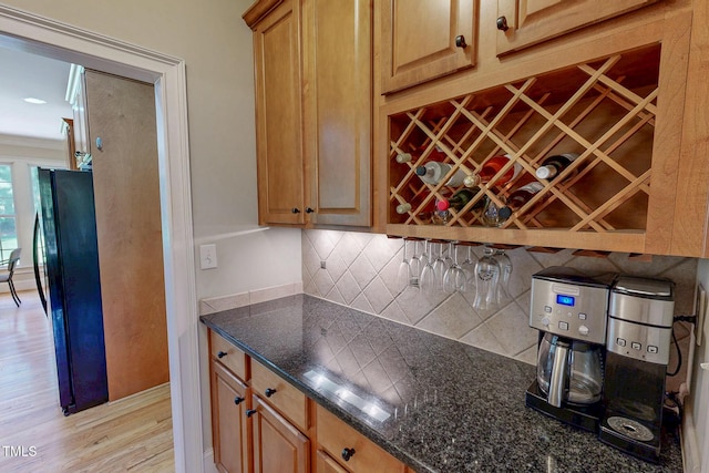4 Springtree Cir, Durham, NC 27712 - kitchen with freestanding refrigerator, backsplash, light wood finished floors, and dark stone counters