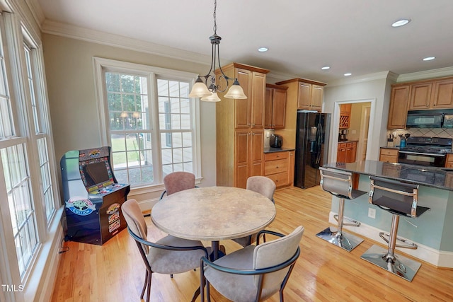 4 Springtree Cir, Durham, NC 27712 - dining room featuring healthy amount of natural light, light wood-type flooring, crown molding, and recessed lighting