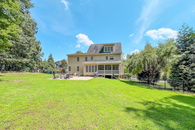 4 Springtree Cir, Durham, NC 27712 - rear view of house featuring a sunroom, a patio area, and roof with shingles