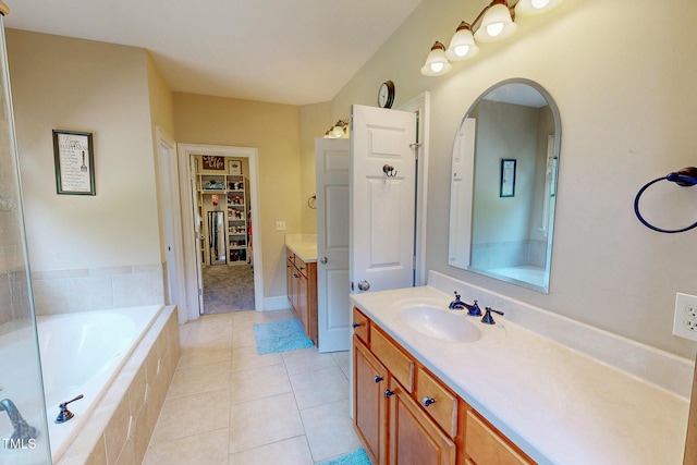4 Springtree Cir, Durham, NC 27712 - full bath featuring vanity, a garden tub, tile patterned floors, and a walk in closet