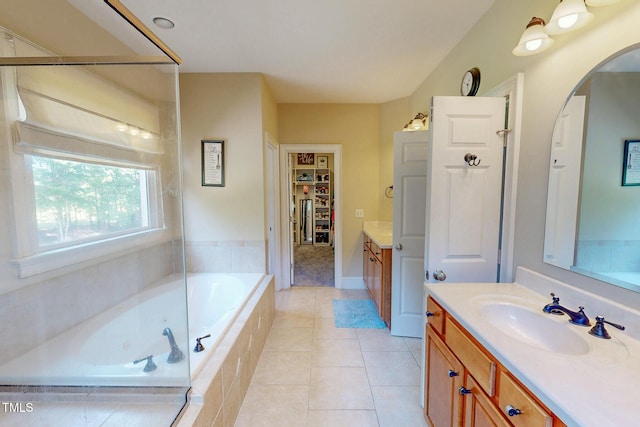 4 Springtree Cir, Durham, NC 27712 - bathroom featuring vanity, a garden tub, a spacious closet, and tile patterned floors