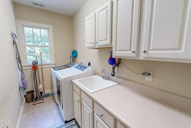 4 Springtree Cir, Durham, NC 27712 - washroom with cabinet space, washing machine and clothes dryer, and light tile patterned flooring