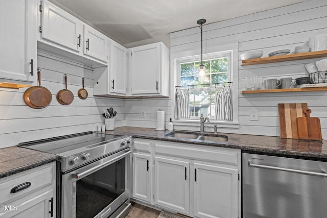 1604 Farm Lake Dr, Holly Springs, NC 27540 - kitchen featuring appliances with stainless steel finishes, white cabinetry, open shelves, dark stone countertops, and tasteful backsplash