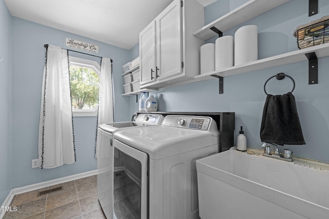 1604 Farm Lake Dr, Holly Springs, NC 27540 - laundry room with cabinet space and washing machine and clothes dryer