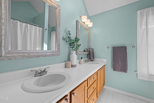 1604 Farm Lake Dr, Holly Springs, NC 27540 - bathroom featuring double vanity and tile patterned flooring