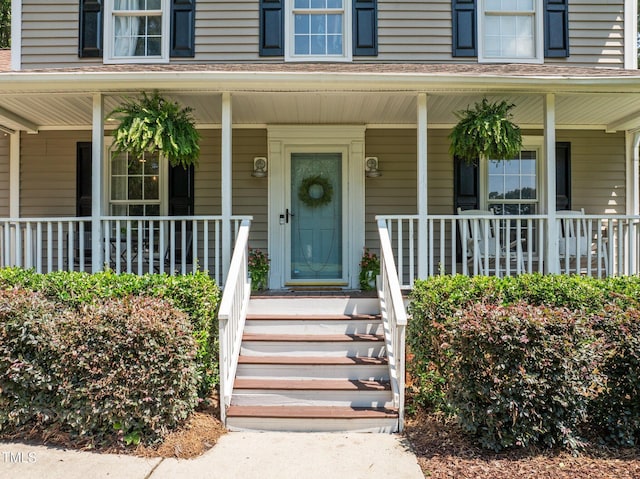 1604 Farm Lake Dr, Holly Springs, NC 27540 - doorway to property featuring covered porch