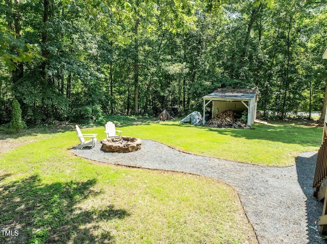 1604 Farm Lake Dr, Holly Springs, NC 27540 - view of grassy yard with a fire pit