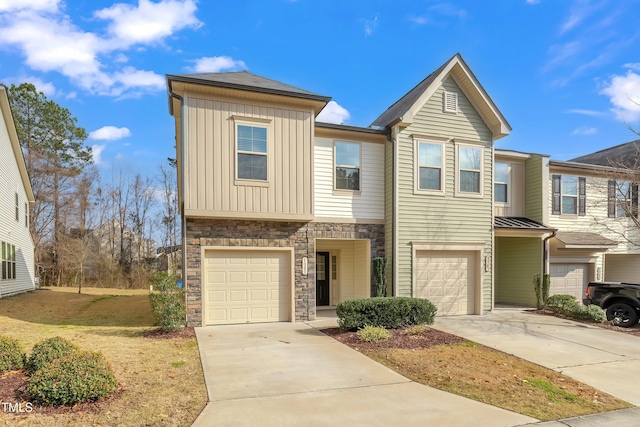 1301 Garden Stone Dr, Raleigh, NC 27610 - view of front of property with an attached garage, driveway, and stone siding