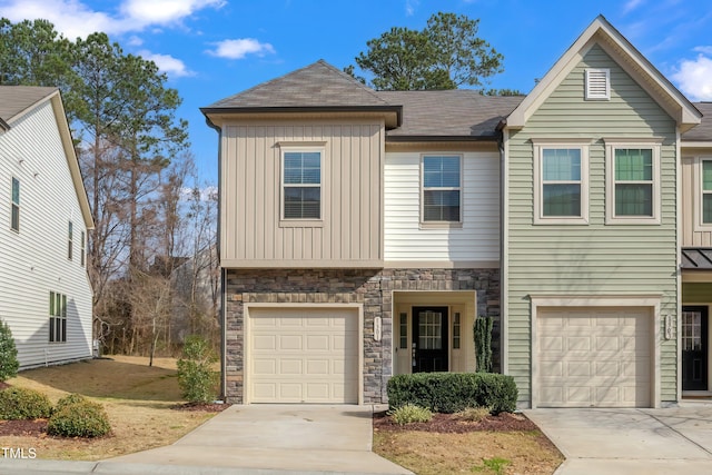 1301 Garden Stone Dr, Raleigh, NC 27610 - craftsman-style home featuring a garage, concrete driveway, and stone siding