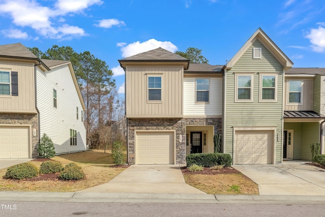 1301 Garden Stone Dr, Raleigh, NC 27610 - craftsman house with a garage, stone siding, concrete driveway, and board and batten siding