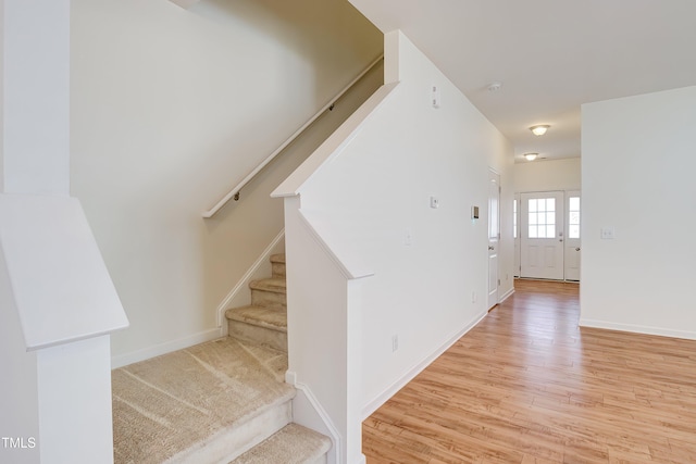 1301 Garden Stone Dr, Raleigh, NC 27610 - stairs with wood finished floors and baseboards