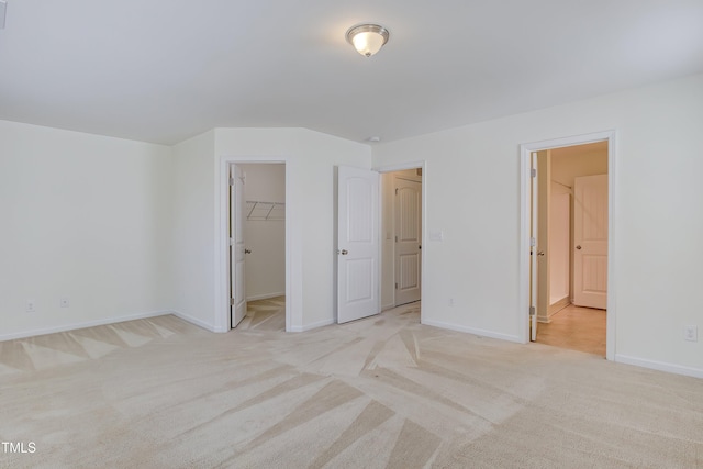 1301 Garden Stone Dr, Raleigh, NC 27610 - unfurnished bedroom with light carpet and a spacious closet
