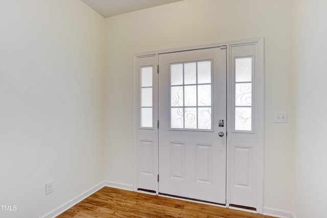 1301 Garden Stone Dr, Raleigh, NC 27610 - foyer entrance featuring baseboards and wood finished floors