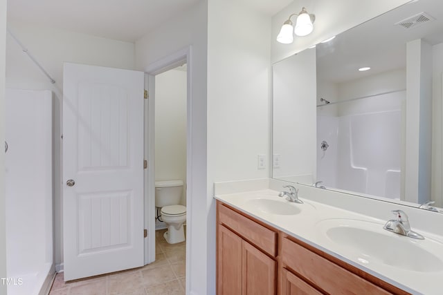 1301 Garden Stone Dr, Raleigh, NC 27610 - full bath featuring double vanity, tile patterned floors, and a shower