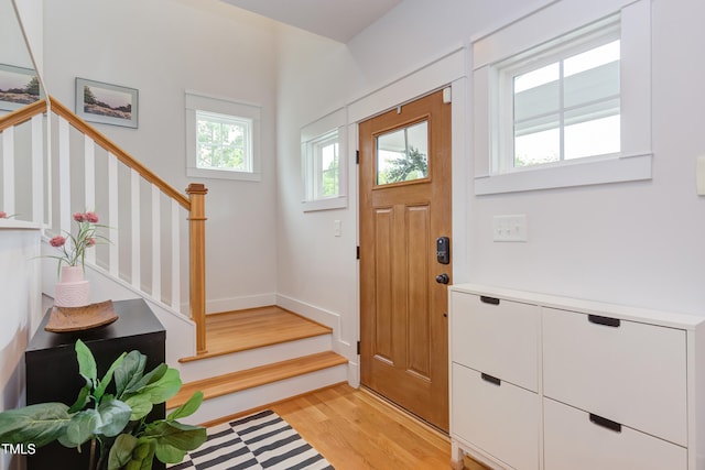 119 W Piedmont Ave, Durham, NC 27707 - foyer entrance with stairs and light wood-style floors
