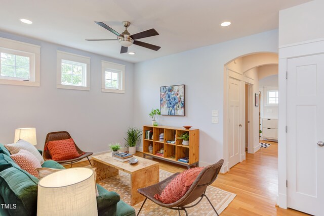 119 W Piedmont Ave, Durham, NC 27707 - living area featuring arched walkways, plenty of natural light, ceiling fan, light wood-style floors, and recessed lighting