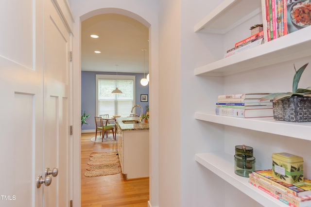 119 W Piedmont Ave, Durham, NC 27707 - hallway with arched walkways, light wood-type flooring, and recessed lighting