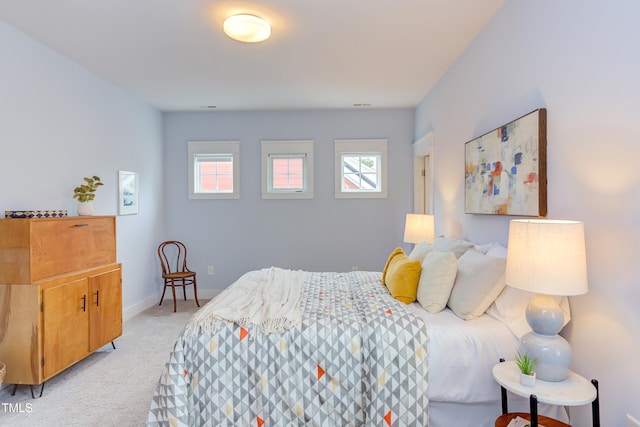 119 W Piedmont Ave, Durham, NC 27707 - bedroom with light carpet and baseboards