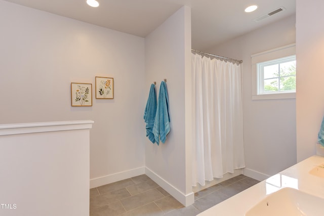 119 W Piedmont Ave, Durham, NC 27707 - full bathroom featuring tile patterned floors, recessed lighting, a shower with shower curtain, and double vanity