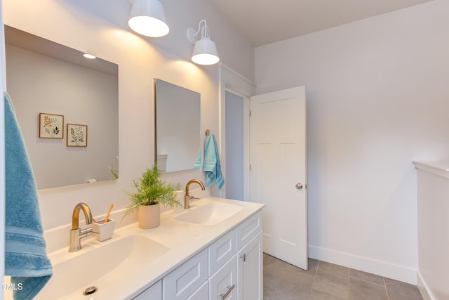 119 W Piedmont Ave, Durham, NC 27707 - bathroom with double vanity and tile patterned floors