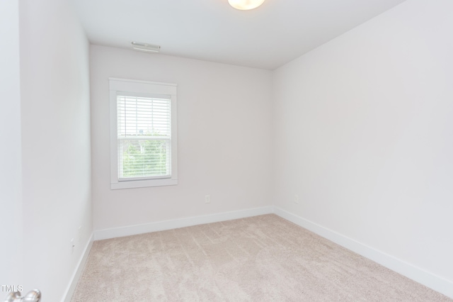 119 W Piedmont Ave, Durham, NC 27707 - carpeted empty room featuring baseboards